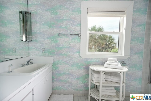 bathroom with vanity and tile patterned flooring