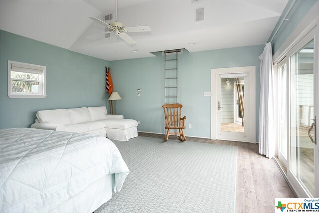 bedroom featuring wood-type flooring, ceiling fan, and vaulted ceiling