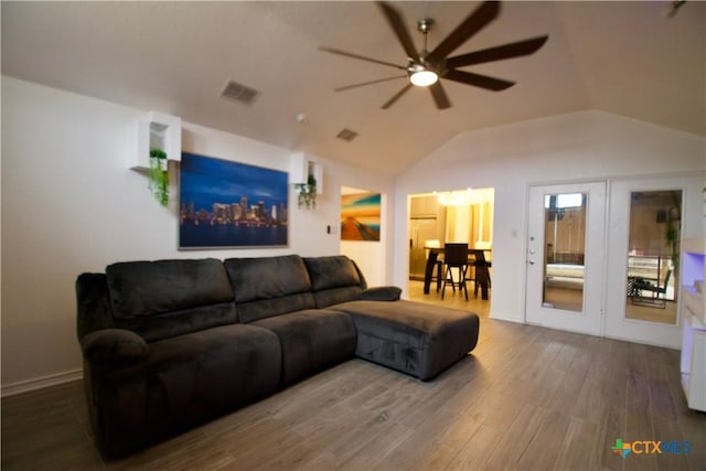 living room with hardwood / wood-style flooring, lofted ceiling, and ceiling fan