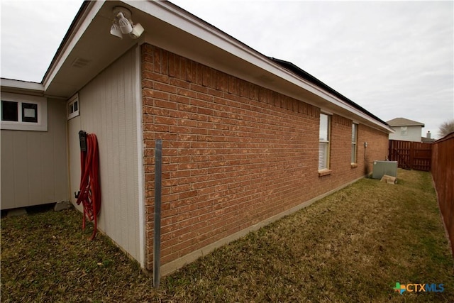 view of property exterior with a yard