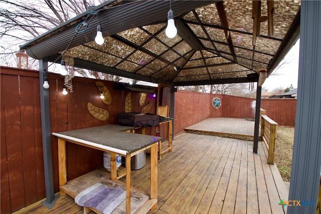 deck with a gazebo and grilling area