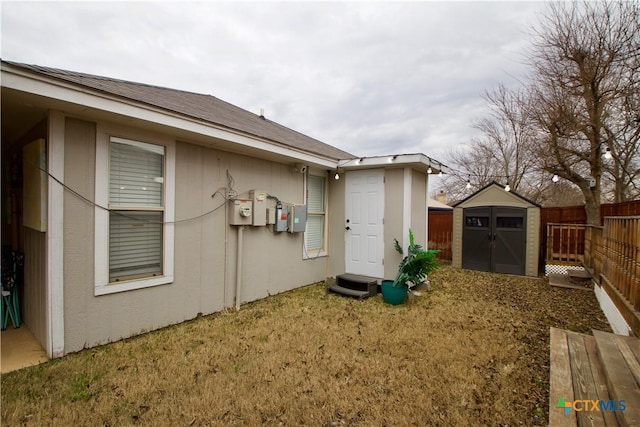 exterior space featuring a shed and a yard