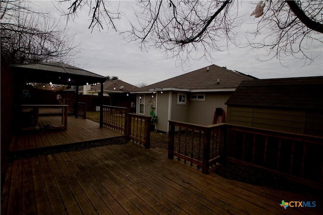 wooden deck featuring a gazebo