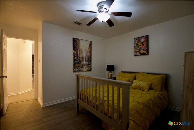 bedroom featuring ceiling fan and hardwood / wood-style floors