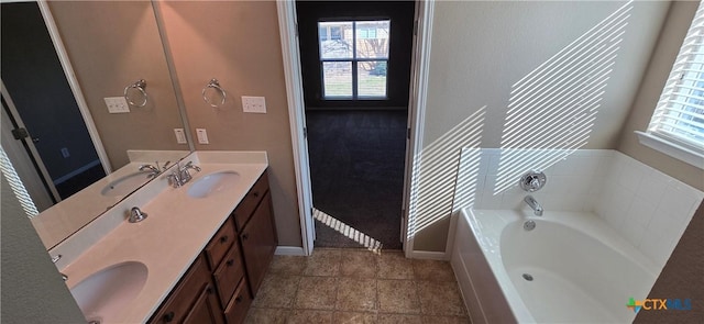 full bathroom featuring plenty of natural light and a sink