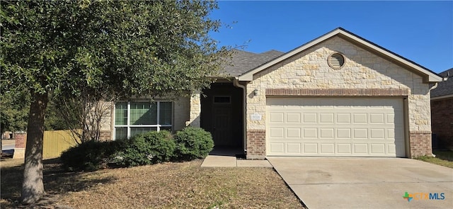 view of front of property with stone siding, concrete driveway, brick siding, and an attached garage