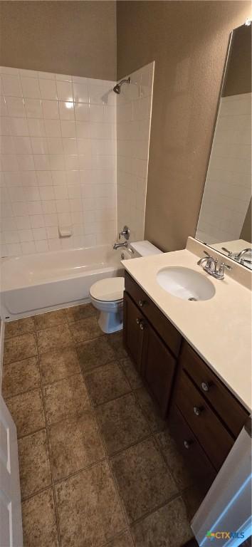 full bathroom featuring shower / bath combination, toilet, and vanity