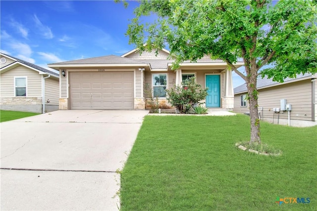 2324 Bellmont, Temple, TX 76504 - view of front facade with stone siding, a garage, driveway, and a front yard