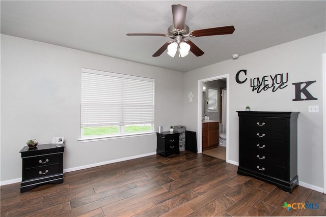 2324 Bellmont, Temple, TX 76504 - bedroom featuring wood finished floors, baseboards, connected bathroom, and ceiling fan