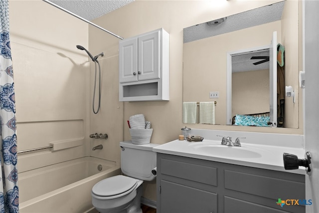 full bathroom featuring vanity, shower / bath combo, a textured ceiling, and toilet