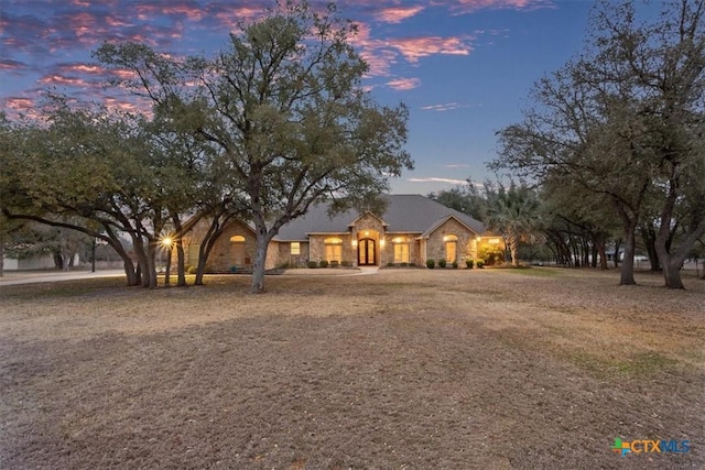 view of front facade with stone siding