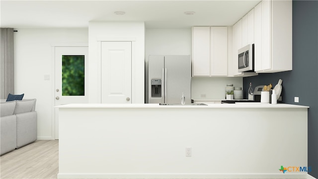 kitchen with light countertops, fridge with ice dispenser, a peninsula, light wood-style floors, and white cabinetry