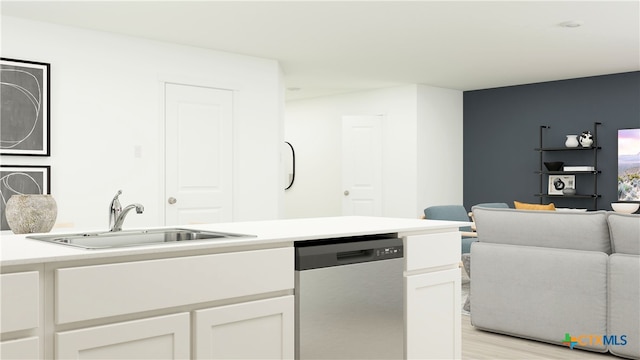 kitchen featuring dishwasher, a sink, light countertops, light wood-style floors, and white cabinetry