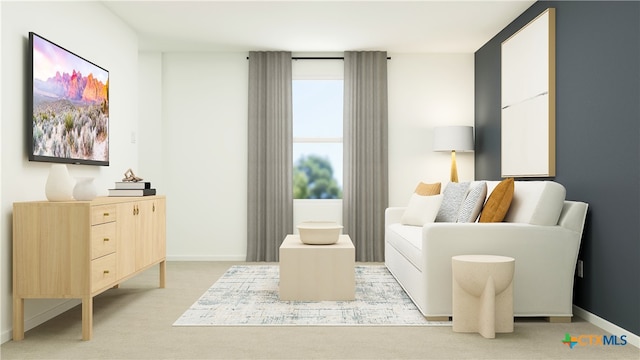 sitting room featuring baseboards and light carpet