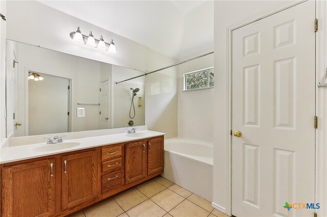 8430 Alvin High Ln, Austin, TX 78729 - bathroom with double vanity, tile patterned floors, and shower / tub combination
