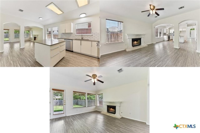 8430 Alvin High Ln, Austin, TX 78729 - unfurnished living room with a lit fireplace, a ceiling fan, a sink, and vaulted ceiling