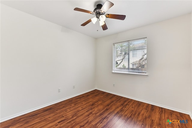 8430 Alvin High Ln, Austin, TX 78729 - unfurnished room featuring dark wood-type flooring, baseboards, and a ceiling fan