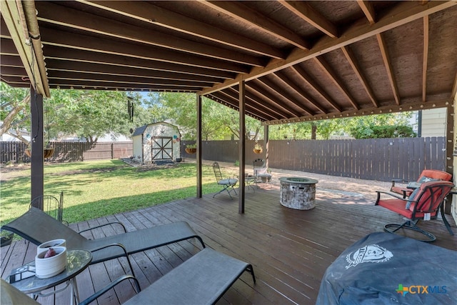 exterior space featuring a lawn and a storage shed