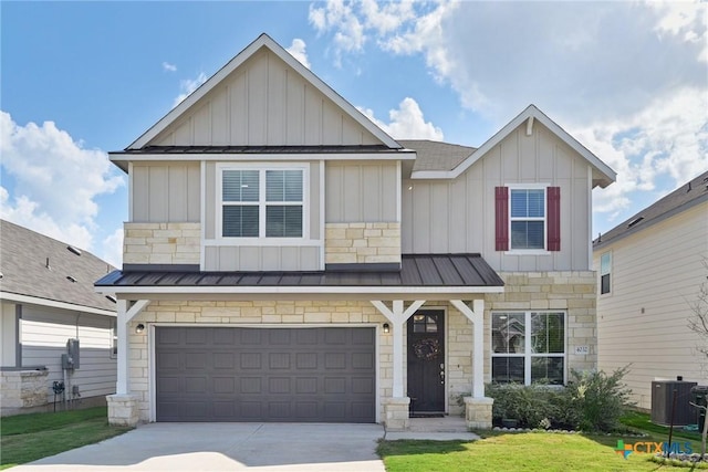 4032 Wild Bloom Rd, Seguin, TX 78155 - craftsman-style house featuring a standing seam roof, board and batten siding, concrete driveway, stone siding, and a garage