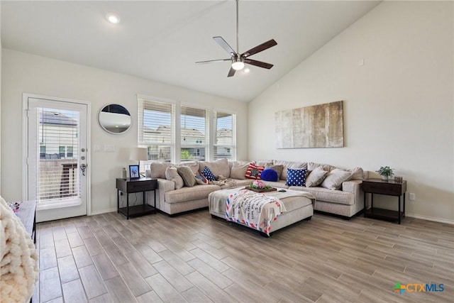 4032 Wild Bloom Rd, Seguin, TX 78155 - living room with ceiling fan, light wood-style flooring, healthy amount of natural light, and high vaulted ceiling
