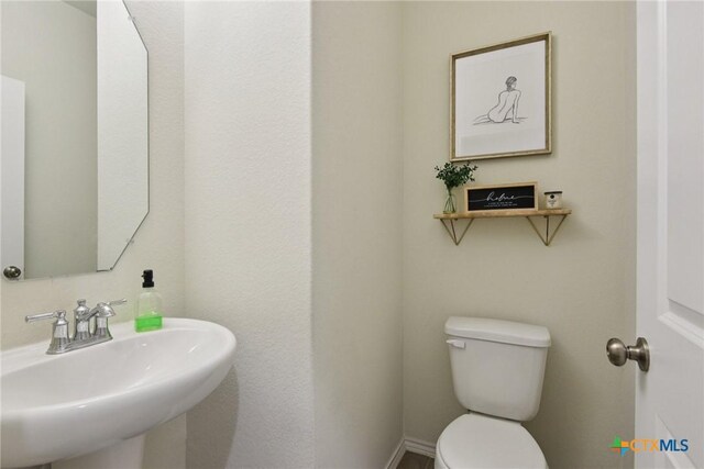 4032 Wild Bloom Rd, Seguin, TX 78155 - half bath with a sink and toilet