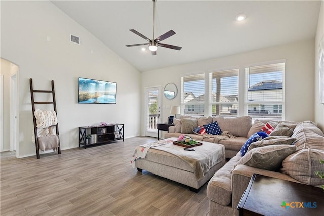 4032 Wild Bloom Rd, Seguin, TX 78155 - living area featuring a ceiling fan, high vaulted ceiling, arched walkways, light wood-style floors, and recessed lighting