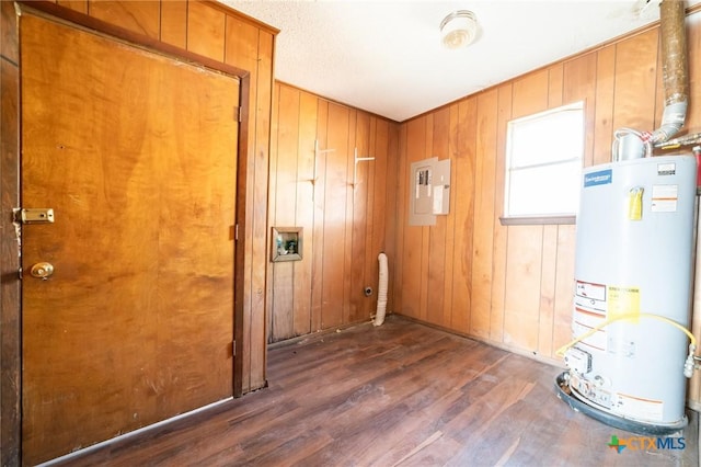 utility room with electric panel and gas water heater