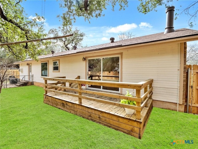 back of house with a yard and fence