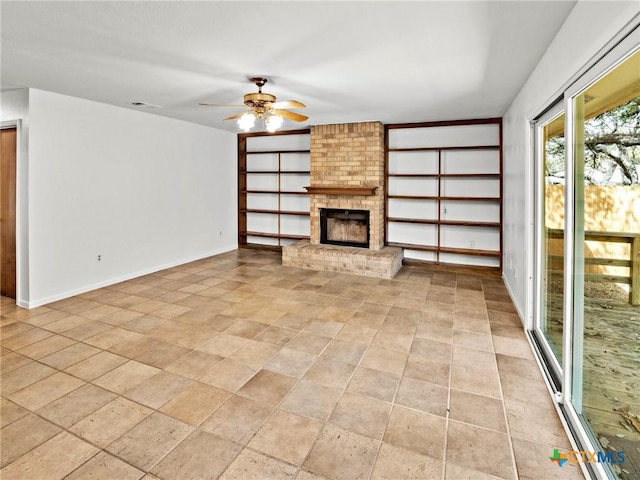 unfurnished living room featuring baseboards, a fireplace, visible vents, and ceiling fan