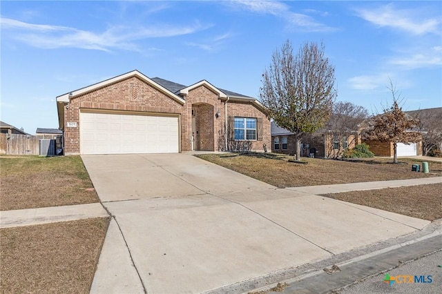 single story home featuring a front yard and a garage