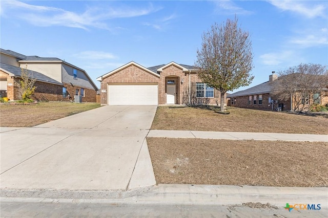 view of front of house with a garage and a front yard