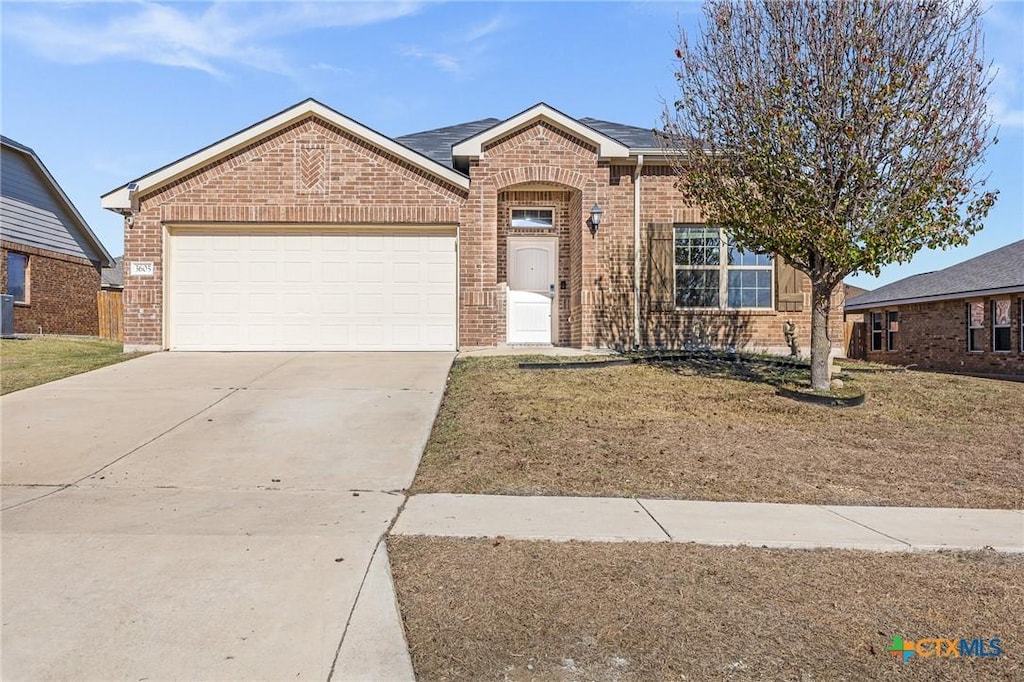 single story home featuring central AC and a garage