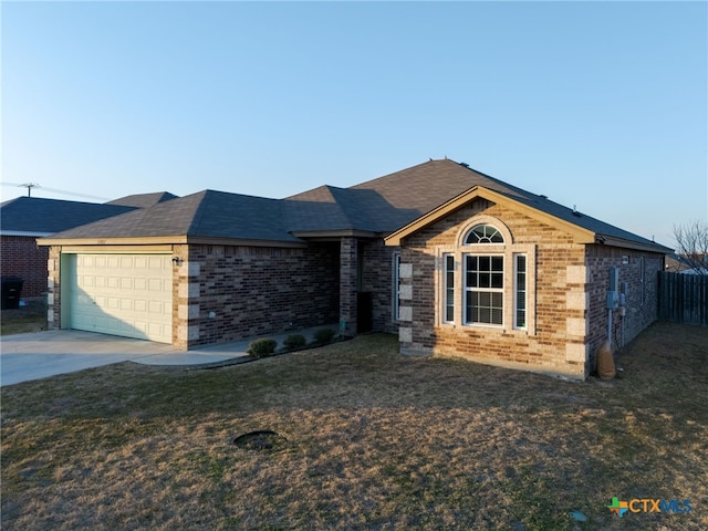 ranch-style house with concrete driveway, an attached garage, fence, a front lawn, and brick siding