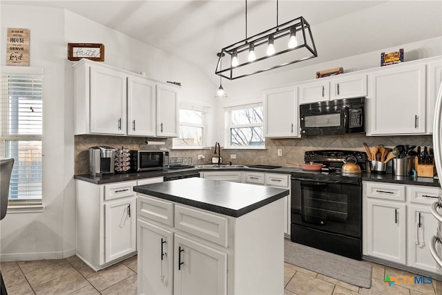 kitchen with tasteful backsplash, dark countertops, a sink, and black appliances