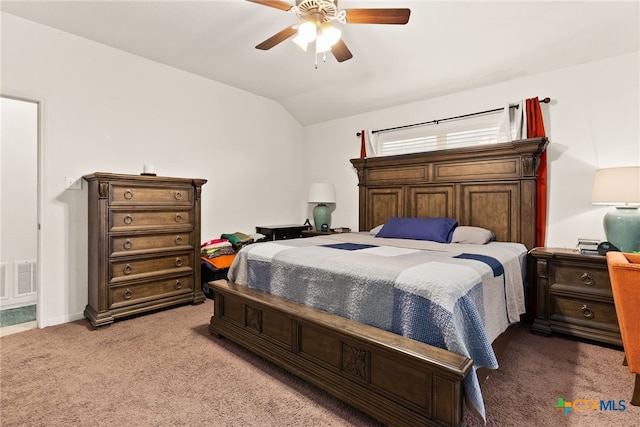 bedroom featuring visible vents, a ceiling fan, light carpet, vaulted ceiling, and baseboards