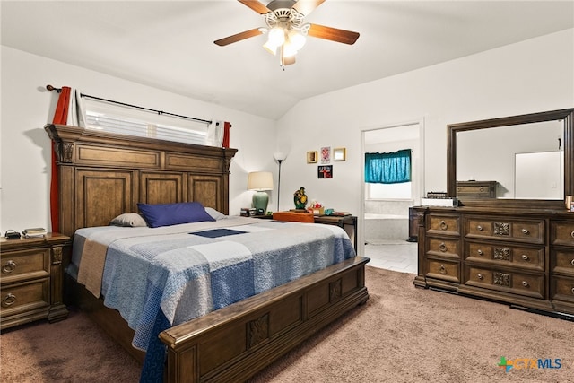 bedroom featuring carpet floors, vaulted ceiling, and a ceiling fan