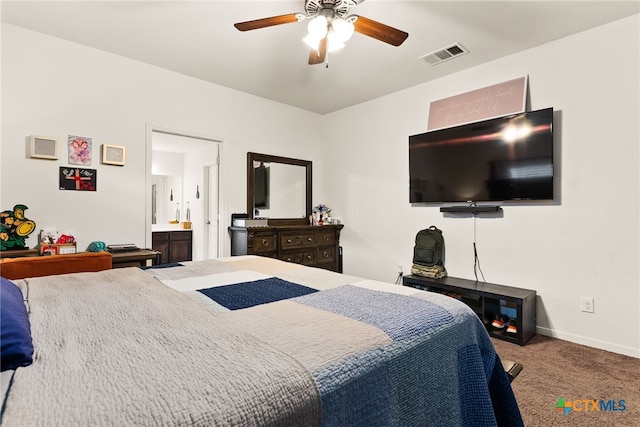 bedroom featuring baseboards, visible vents, connected bathroom, ceiling fan, and carpet flooring