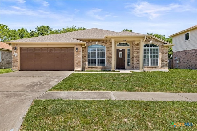 2003 Schottische Ln, Killeen, TX 76542 - ranch-style house with a garage, concrete driveway, a front yard, and brick siding