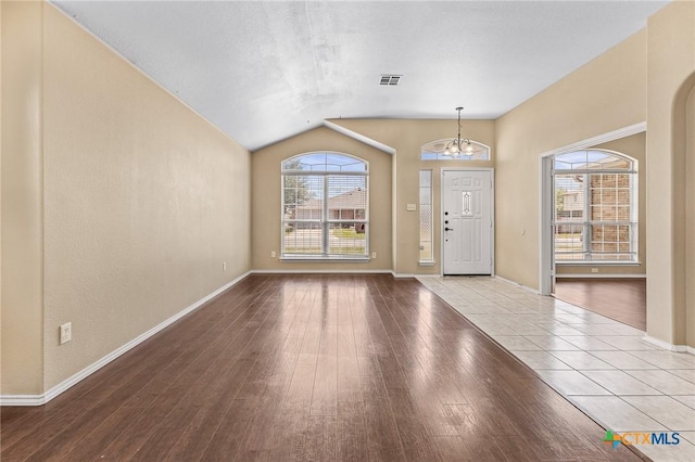 2003 Schottische Ln, Killeen, TX 76542 - entryway featuring a chandelier, lofted ceiling, wood finished floors, and baseboards