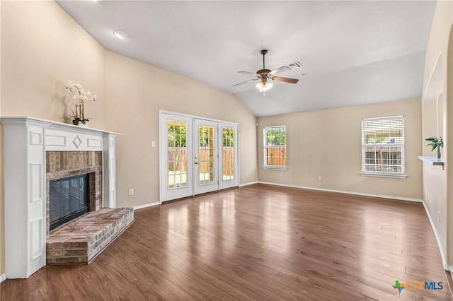 2003 Schottische Ln, Killeen, TX 76542 - unfurnished living room with vaulted ceiling, a ceiling fan, a fireplace, baseboards, and wood finished floors