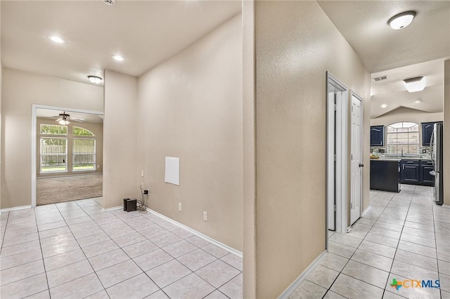 2003 Schottische Ln, Killeen, TX 76542 - hall featuring light tile patterned floors, plenty of natural light, baseboards, vaulted ceiling, and recessed lighting