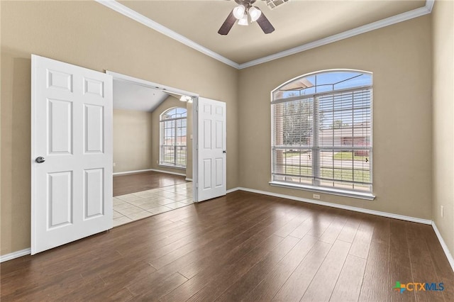 2003 Schottische Ln, Killeen, TX 76542 - unfurnished room featuring crown molding, dark wood-style floors, ceiling fan, and baseboards