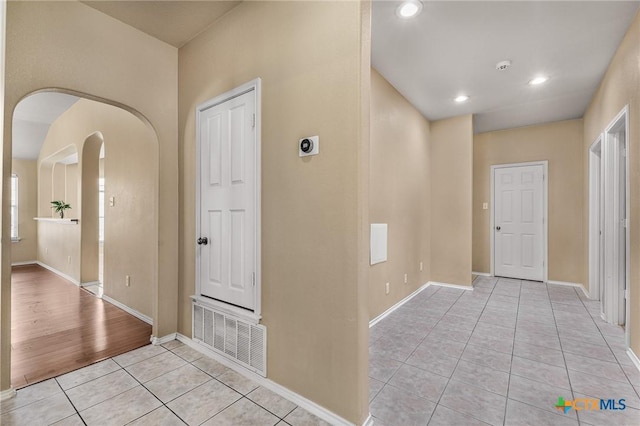 2003 Schottische Ln, Killeen, TX 76542 - corridor featuring light tile patterned floors, baseboards, recessed lighting, and arched walkways