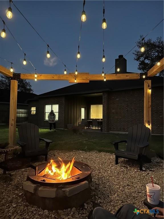 exterior space featuring an outdoor fire pit