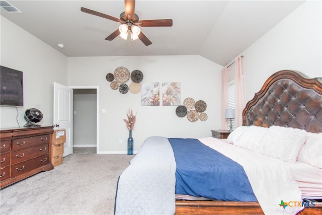 carpeted bedroom featuring ceiling fan and vaulted ceiling