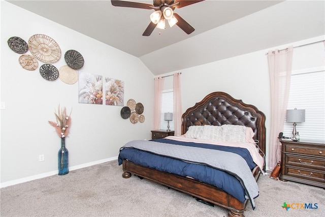 carpeted bedroom featuring vaulted ceiling and ceiling fan