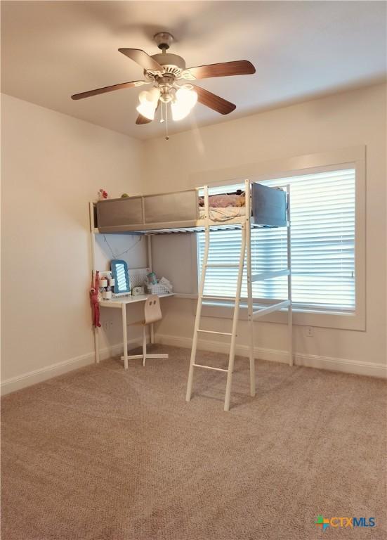 127 Augusta Dr, Wimberley, TX 78676 - bedroom featuring light colored carpet, baseboards, and ceiling fan