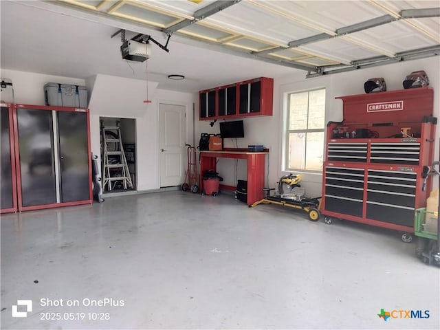 127 Augusta Dr, Wimberley, TX 78676 - garage featuring a garage door opener