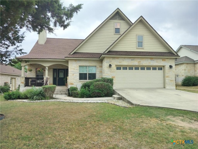 127 Augusta Dr, Wimberley, TX 78676 - traditional-style house with stone siding, a porch, a front yard, driveway, and a chimney