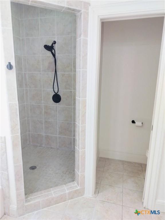 127 Augusta Dr, Wimberley, TX 78676 - bathroom with a shower stall, tile patterned floors, and baseboards